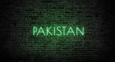 Pakistan - Neon Text Illuminated In The Dark On A Bricks Wallの写真素材