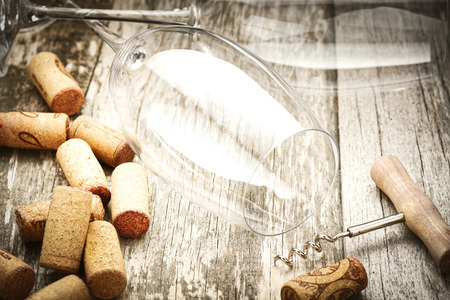Detail of wine glasses and corks in filtered old vintage styleの写真素材
