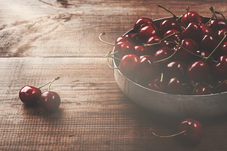 Fresh cherry on a wooden background. fresh ripe cherries. sweet cherries.