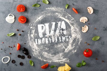 The ingredients for homemade pizza on wooden background. Top view.の写真素材