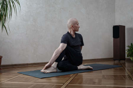 Yoga Practice Exercise Class Concept. Man doing yogaの写真素材