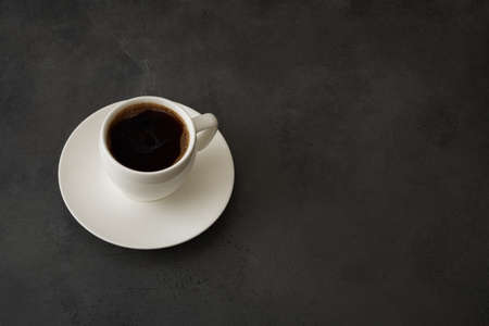 A cup of coffee on the table. Copy space of your text.の写真素材