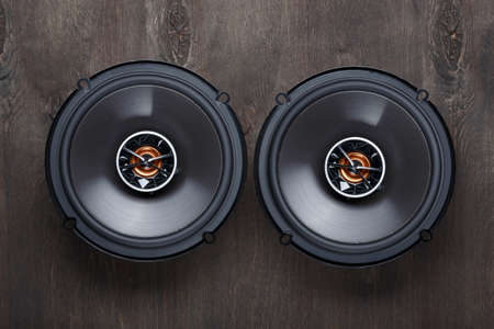 car audio, car speakers, subwoofer and accessories for tuning. dark background. top view.の写真素材