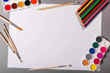 Education. Drawing supplies. Paints, brushes and papers.の写真素材