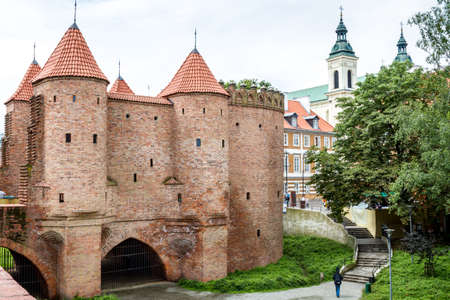 WARSAW, POLAND - JUNE 2: Medieval Castle of red brick, defensive towers with tiled roofs in Warsaw, Poland on June 2, 2014のeditorial素材