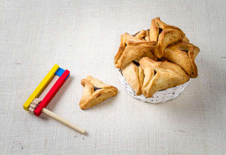 Jewish holiday of Purim. Hamantaschen cookies,  and wooden graggerの写真素材
