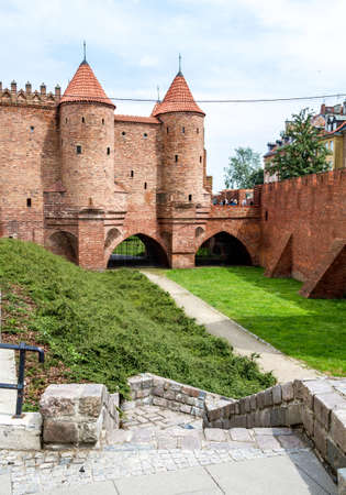 WARSAW, POLAND - JUNE 2: Medieval Castle of red brick, defensive towers with tiled roofs in Warsaw, Poland on June 2, 2014のeditorial素材