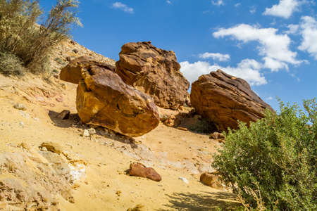 Boulders on the hill in Makhtesh Gadol or Large Crater, nature reserve in Negev desert, Israelの写真素材