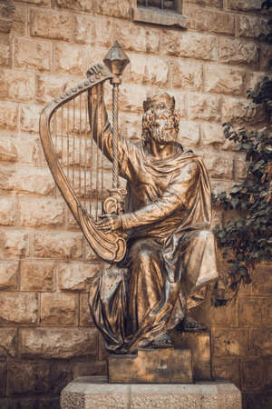 JERUSALEM, ISRAEL - OCTOBER 5: The statue of King David playing the harp near entrance to his tomb on Mount Zion in Jerusalem, Israel on October 5, 2016のeditorial素材