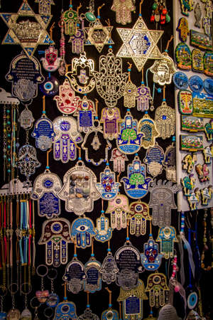 The Hamsa - palm-shaped amulet and Magen David - star of David, souvenirs in gift shop on Arab...