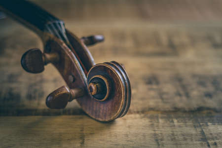 Tuning peg, pegbox of old violin, stringed musical instrument in close-upの写真素材