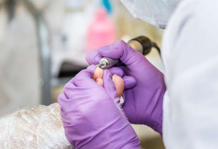 Pedicure process in beauty salon, foot care, close upの写真素材