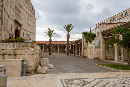 Courtyard of Basilica of the Annunciation, view of the Gallery with mosaic panels of Virgin Mary, Roman Catholic church in Nazareth, Israelの写真素材