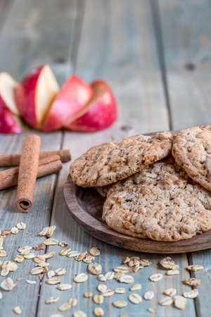 Apple oat cinnamon biscuits on a gray wooden table. Selective focus, front view, copy spaceの写真素材