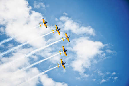 Aircraft flying in formation against bright blue skyのeditorial素材