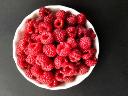 Raspberries in a white bowl