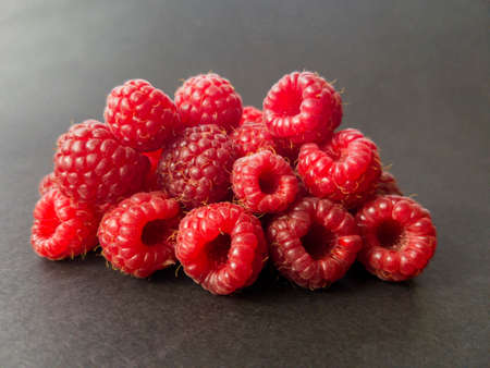Raspberries on a grey background