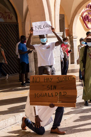 Palma de Mallorca, Spain - June 07 2020: Mens holding banners in a peaceful protest against racism and recent US police brutalityのeditorial素材