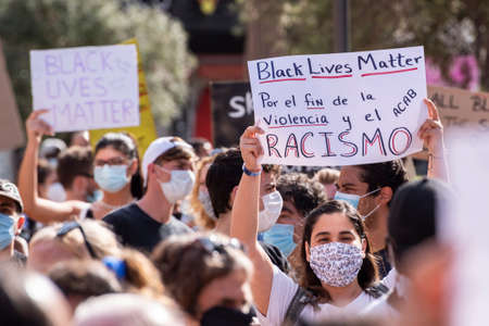 Palma de Mallorca, Spain - June 07 2020: Woman holding a banner in a peaceful protest against racism and recent US police brutalityのeditorial素材