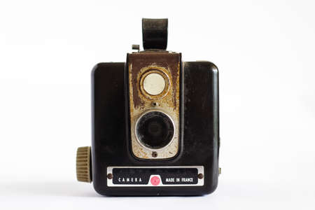 An old black camera of the 50s on white isolated background