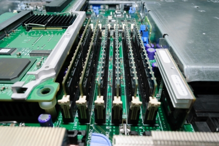 Several strips of RAM on the server motherboard.