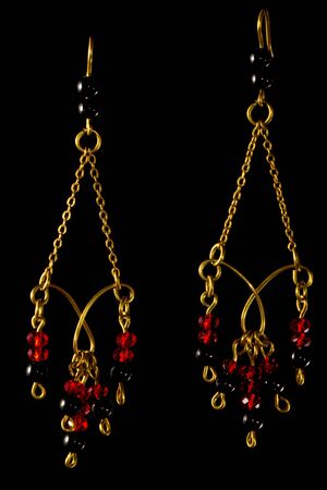 Unique handmade wire-work chain earrings with red and black beadsの写真素材