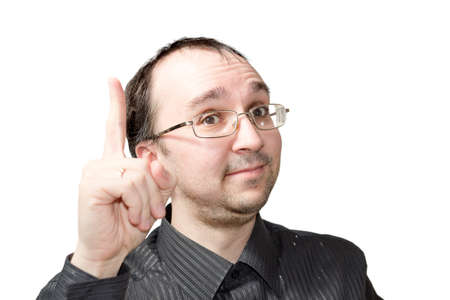 Solid men points upward and draws attention isolated on whiteの写真素材