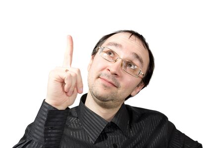 Solid men points upward and draws attention isolated on whiteの写真素材