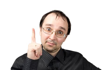 Solid men points upward and draws attention isolated on whiteの写真素材