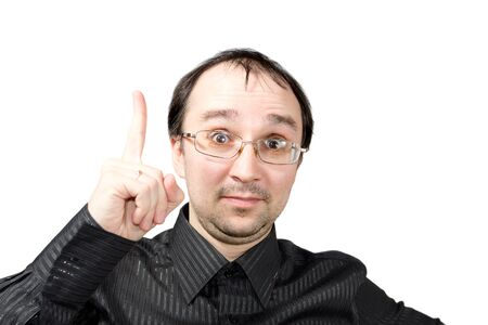 Solid men points upward and draws attention isolated on whiteの写真素材