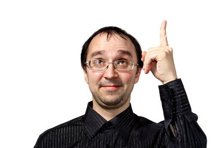 Solid men points upward and draws attention isolated on whiteの写真素材