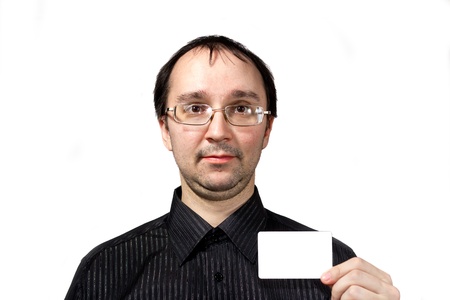 Solid men in black shirt with businesscard isolated on whiteの写真素材
