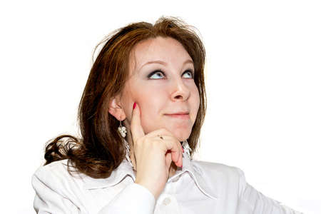 Wishing beautiful women looking upwards isolated on whiteの写真素材