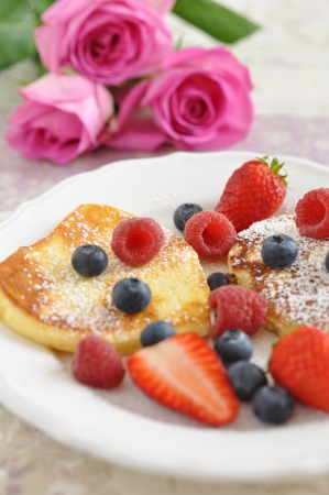 Heart Shaped Pancakes with fresh berriesの写真素材