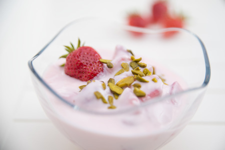 Strawberry Yogurt with pistachiosの写真素材