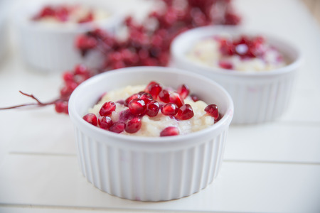 creamy rice pudding with pomegranateの写真素材