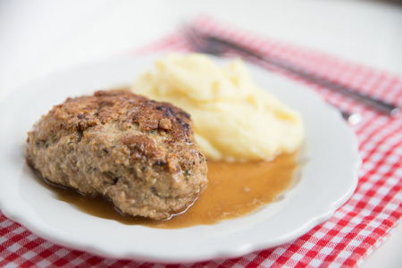 Burger patties with mashed potatoes