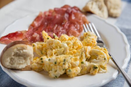 Scrambled eggs with baconの写真素材