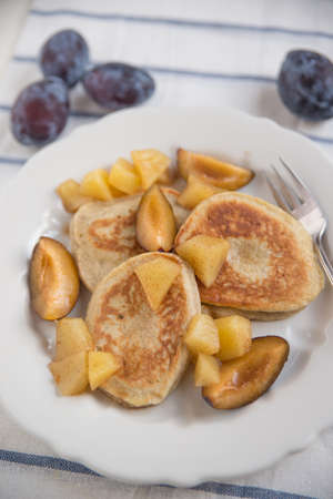 Pancakes with plumsの写真素材