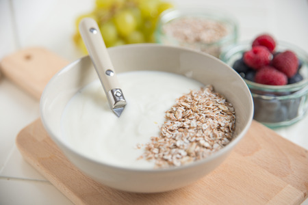 Yogurt with granola and fresh berriesの写真素材