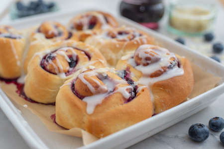 Sweet home made Blueberry cinnamon rolls with lemon frostingの写真素材
