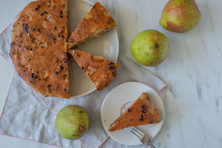 cake with chocolate chips and pearsの写真素材