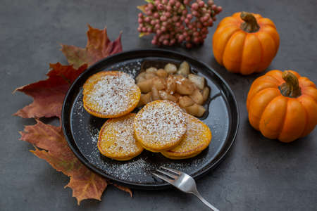 Healthy autumnal breakfast - sweet home made pumpkin pancakesの写真素材
