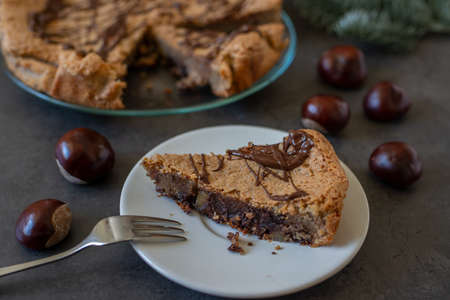 Delicious chestnut cake with almonds and chocolate glaze