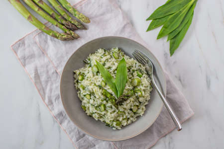Spring food; Delicious risotto with asparagus and wild garlicの写真素材