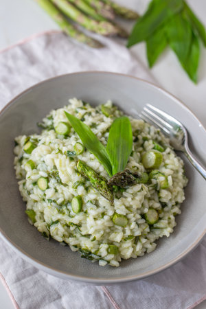 Spring food; Delicious risotto with asparagus and wild garlicの写真素材