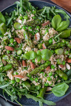 healthy spring couscous salad with asparagus and herbsの写真素材