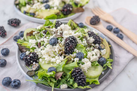 healthy summer salad with berries and feta cheese