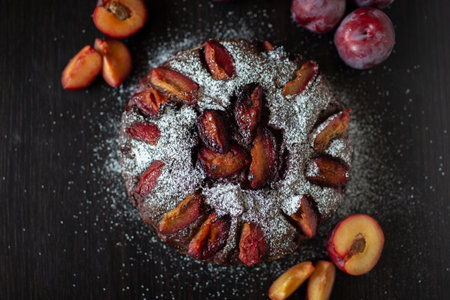 Sweet german chocolate plum cake on a tableの写真素材
