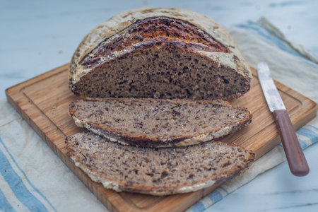 Home made whole grain bread on rustic wooden on a table